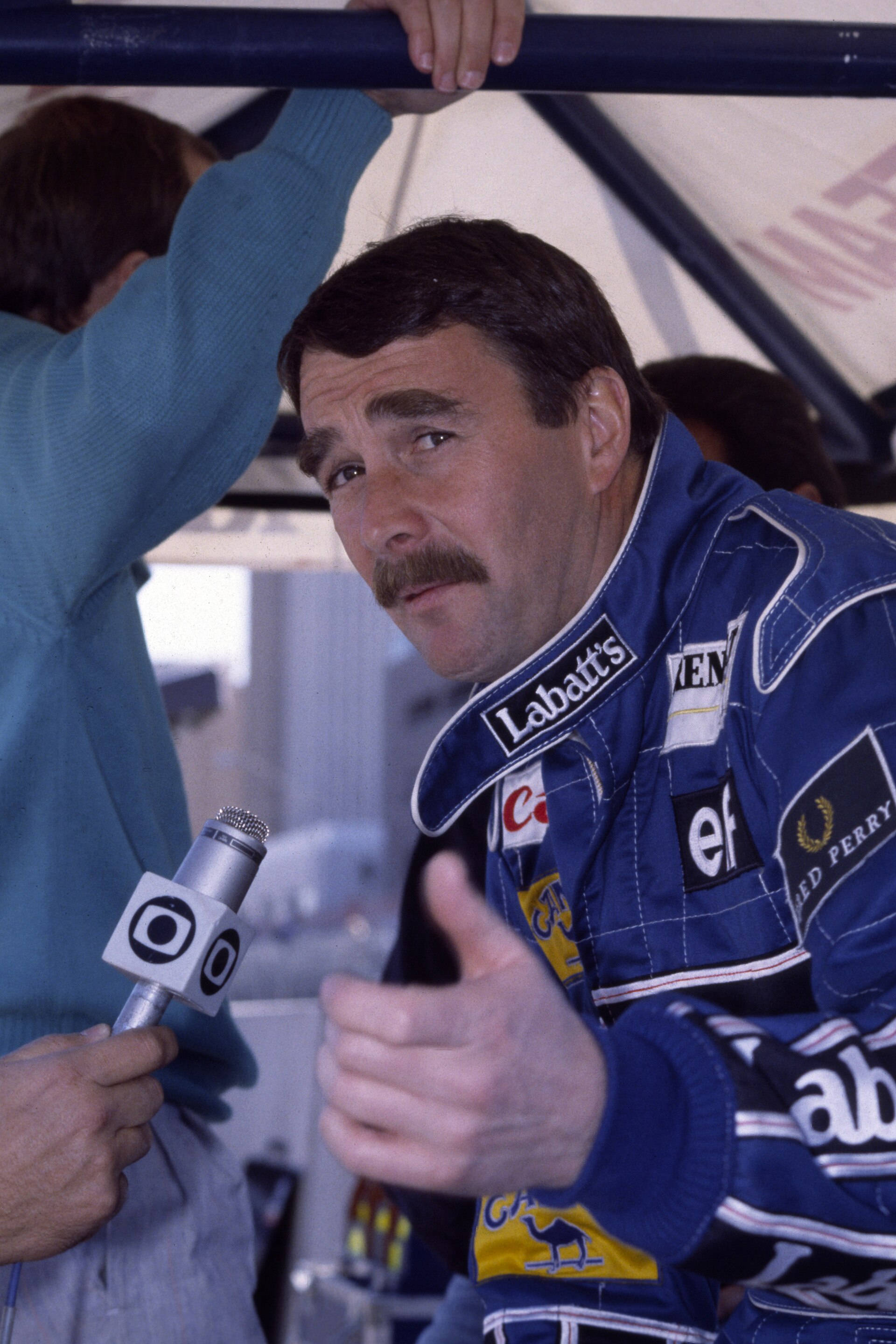 Imagem de referência de Nigel Mansell, descrito nos dados abertos como automobilista britânico, campeão mundial de Fórmula 1 em 1992