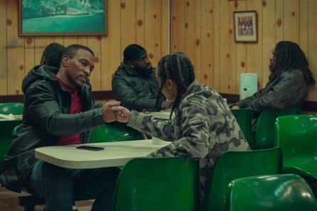 Walters bumps fists with another character over a table