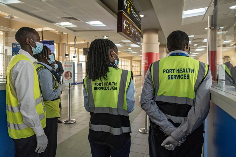 Kenyan Ministry of Health officials screen arriving passengers at Jomo Kenyatta International Airport in Nairobi amid Ebola-related health precautions [AFP]