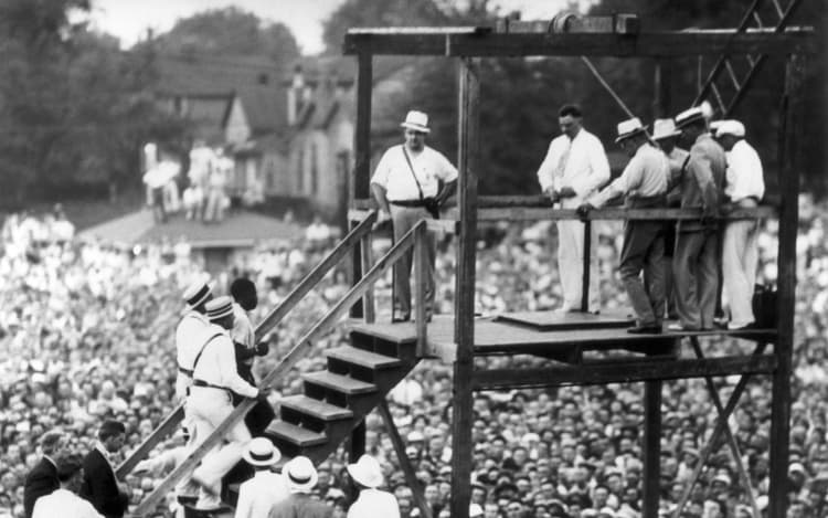 Rainey Bethea, seen at left being escorted to the scaffold, was hanged in the last high-profile public execution in the United states in Kentucky in August 1936.